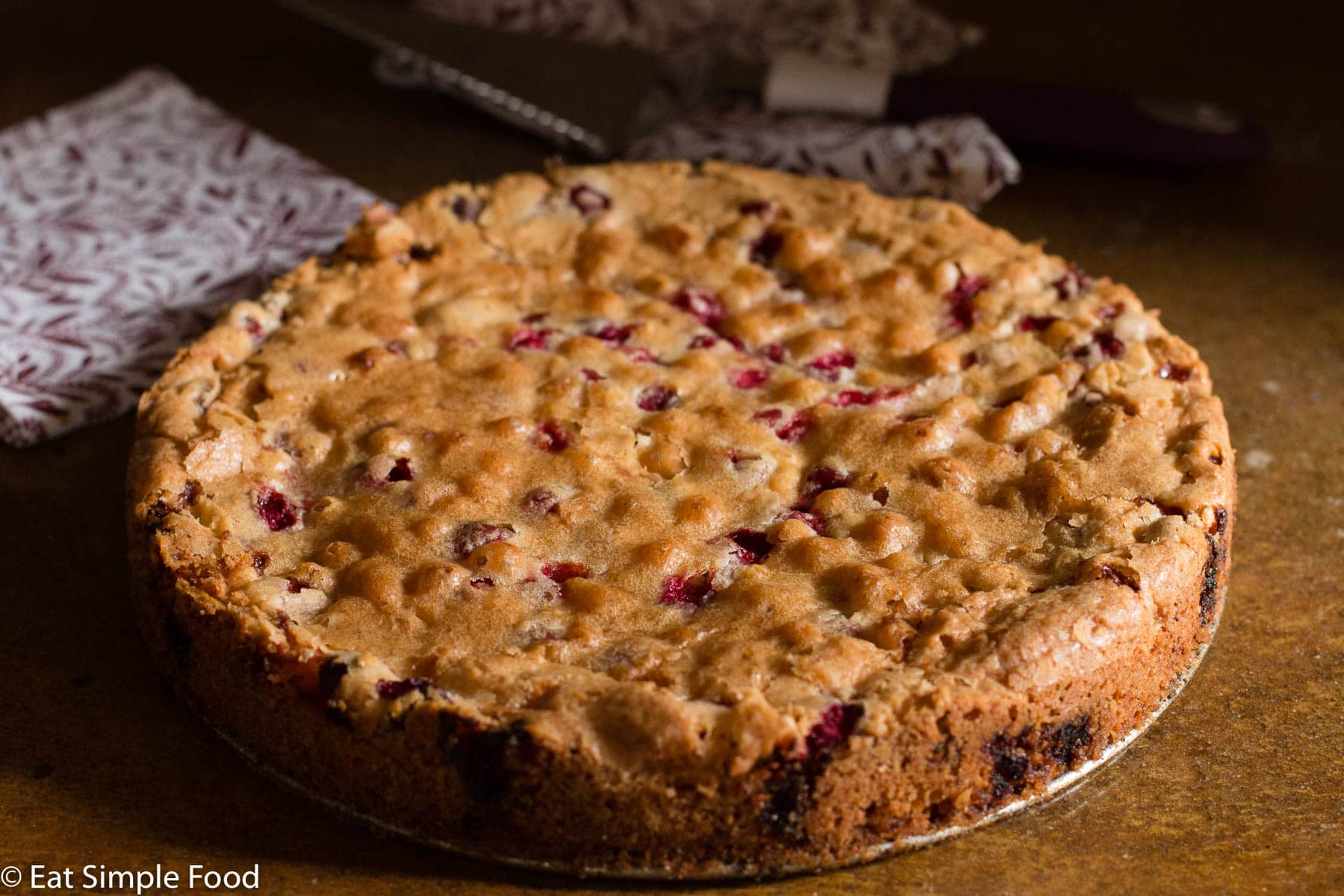 Cranberry and Walnut Cake Baked Recipes, Cooked Golden Brown On A Round Pan.