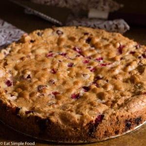 Cranberry and Walnut Cake Baked Recipes, Cooked Golden Brown On A Round Pan.