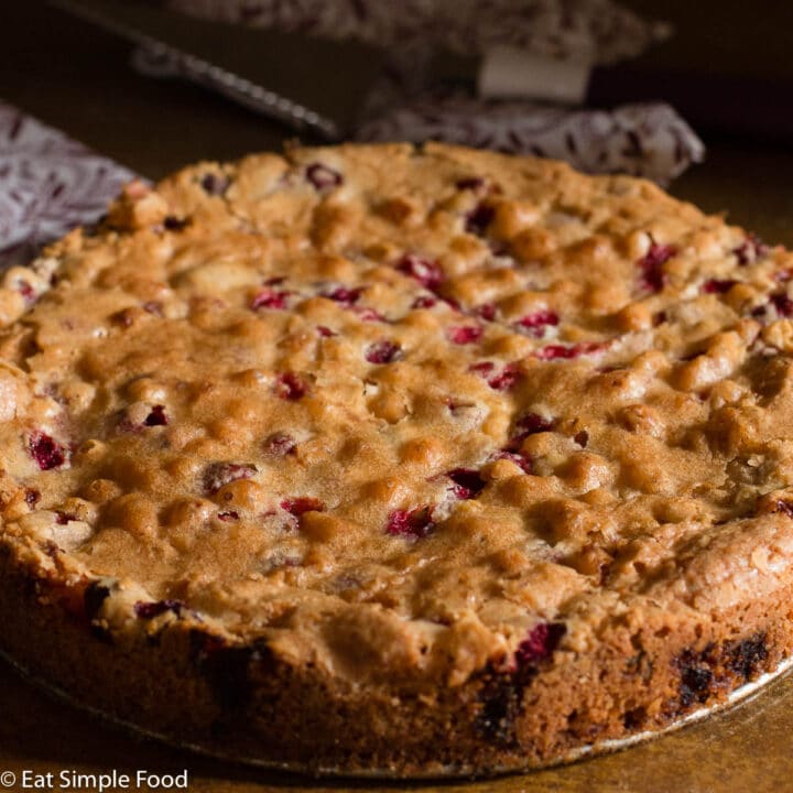 Cranberry and Walnut Cake Baked Recipes, Cooked Golden Brown On A Round Pan.