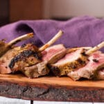 Sliced Cooked Rack Of Lamb Recipe on Live Edge Wood Cutting Board - Eat Simple Food
