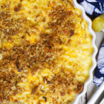 Close up of elbow Macaroni & Yellow Cheddar Cheese Pie topped with golden buttery breadcrumbs.