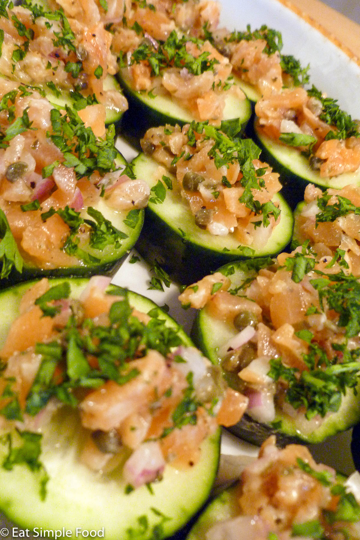 Smoked Salmon Cucumber Rounds With Capers, Red onions, dill, mustard and a Parsley Garnish | EatSimpleFood.com