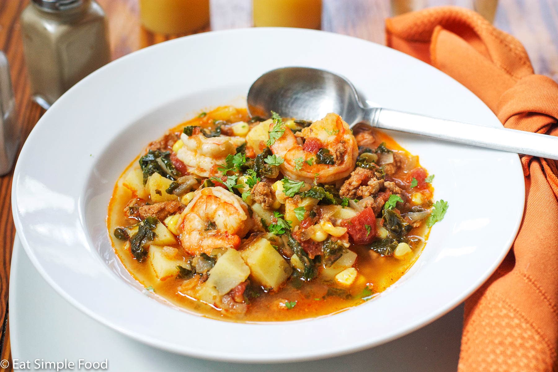 Shrimp and Chorizo Stew w Potatoes and Corn Recipe in A White Bowl - Eat Simple Food