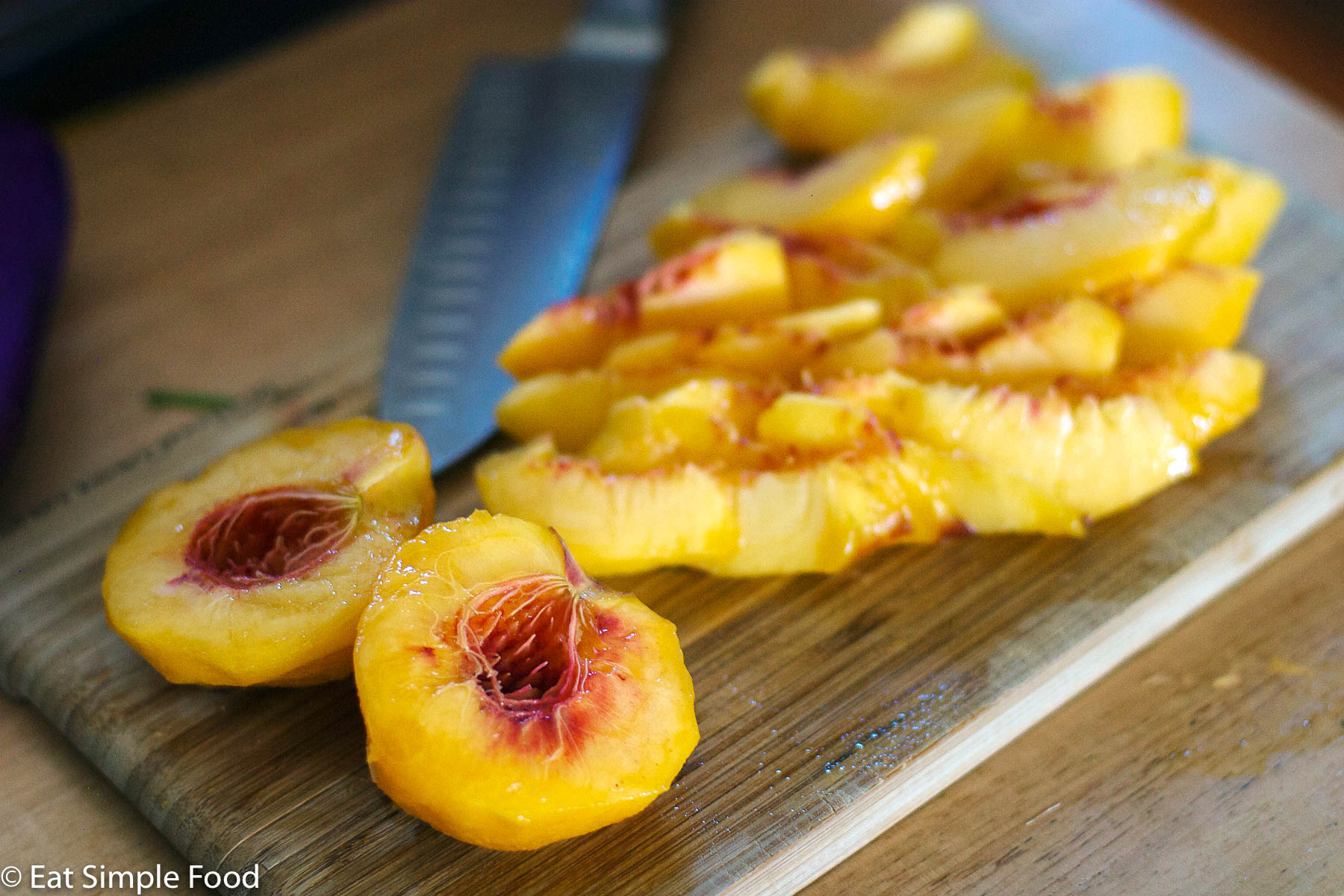 Peaches skinned, halved, and sliced.
