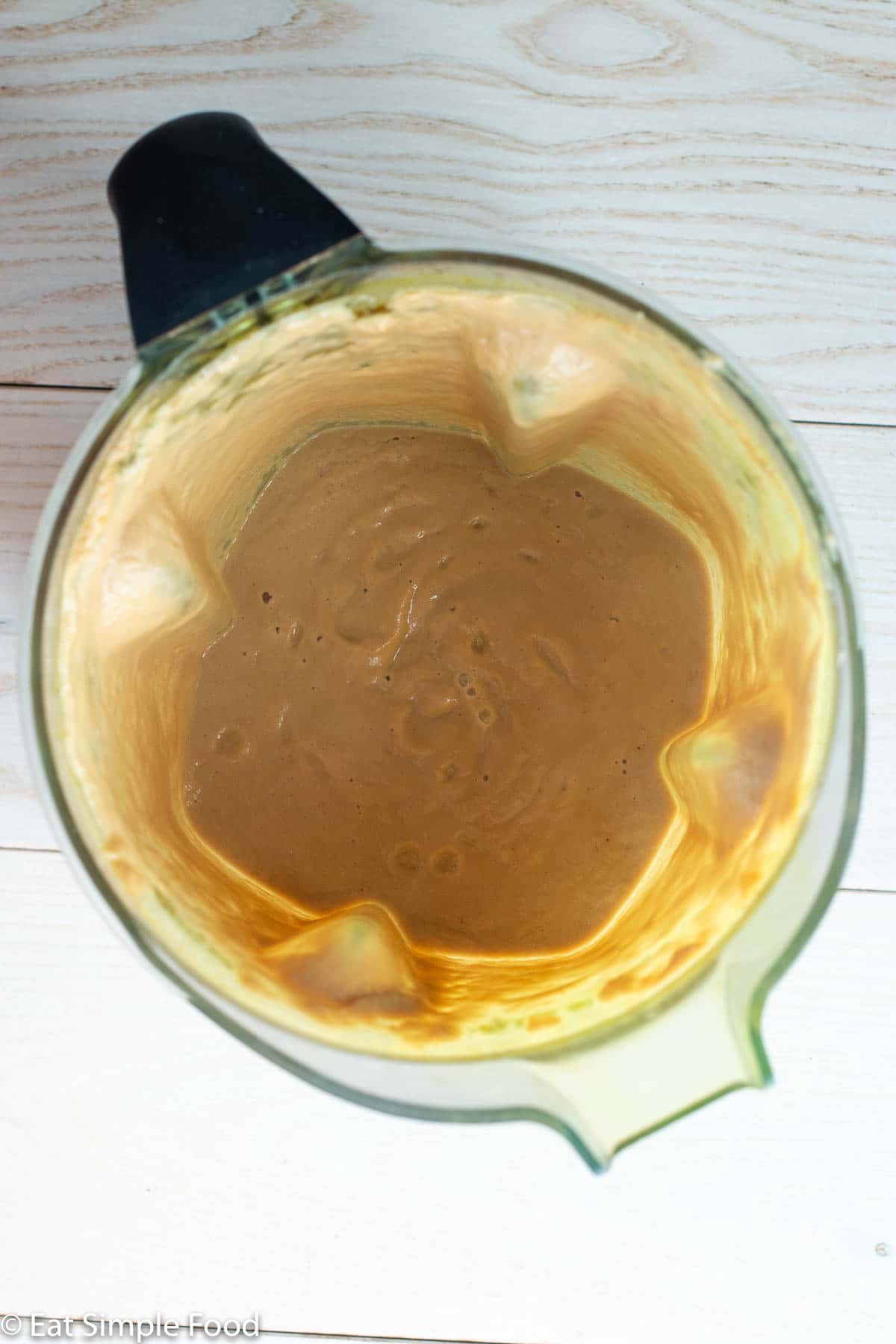 Brown Gravy in a blender. Top down view.